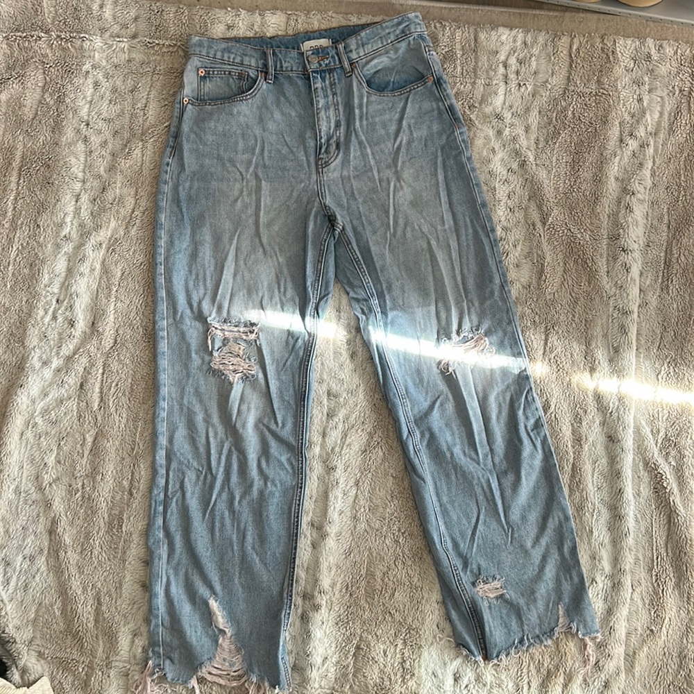 Cowboy cut distressed jeans